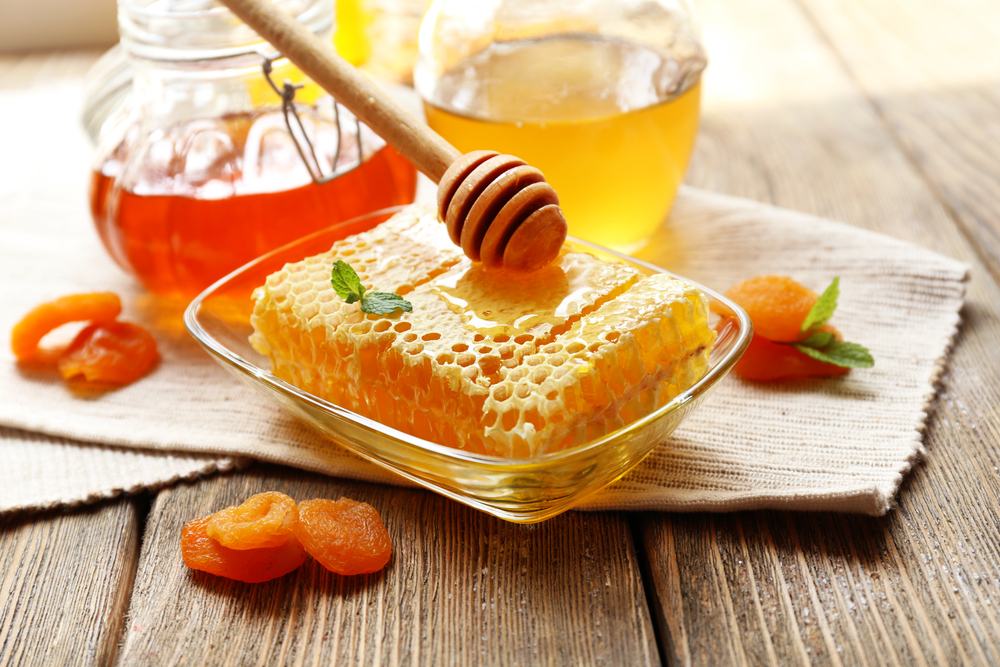 Fresh honey on wooden table